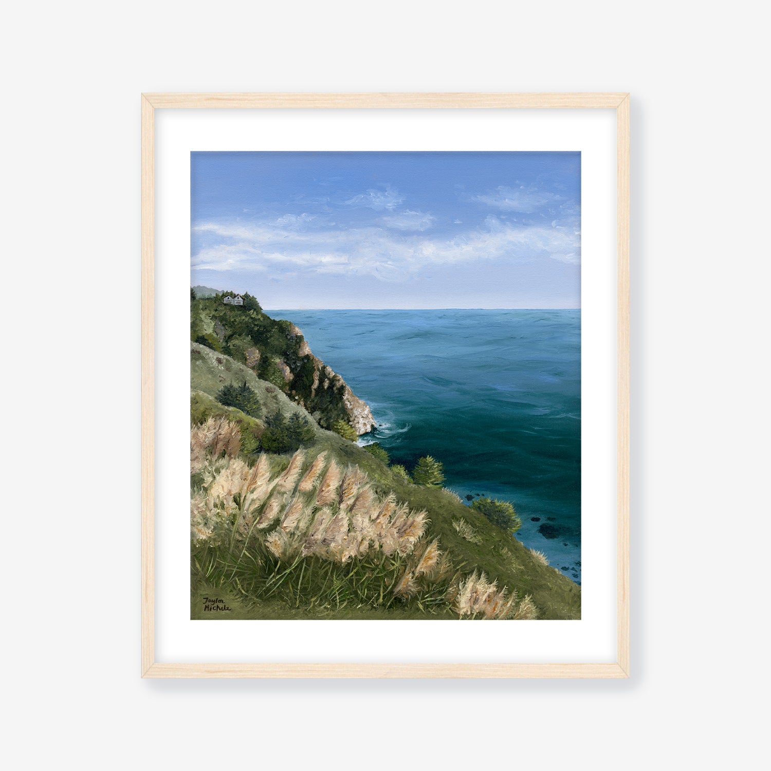 Framed artwork of a coastal landscape with grassy hill and ocean. Maple Frame