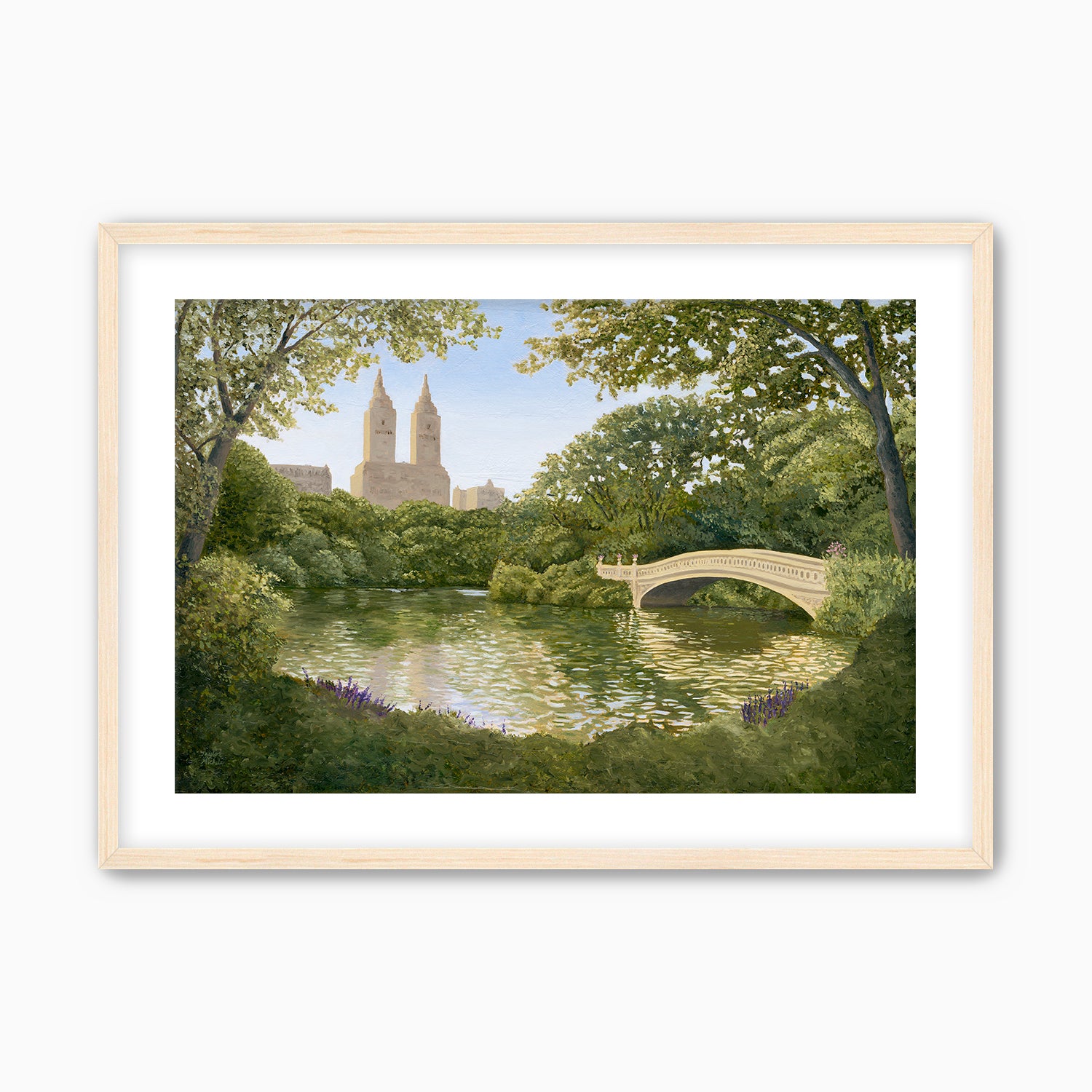 Framed artwork of a park scene with a bridge over a pond and trees. Maple frame