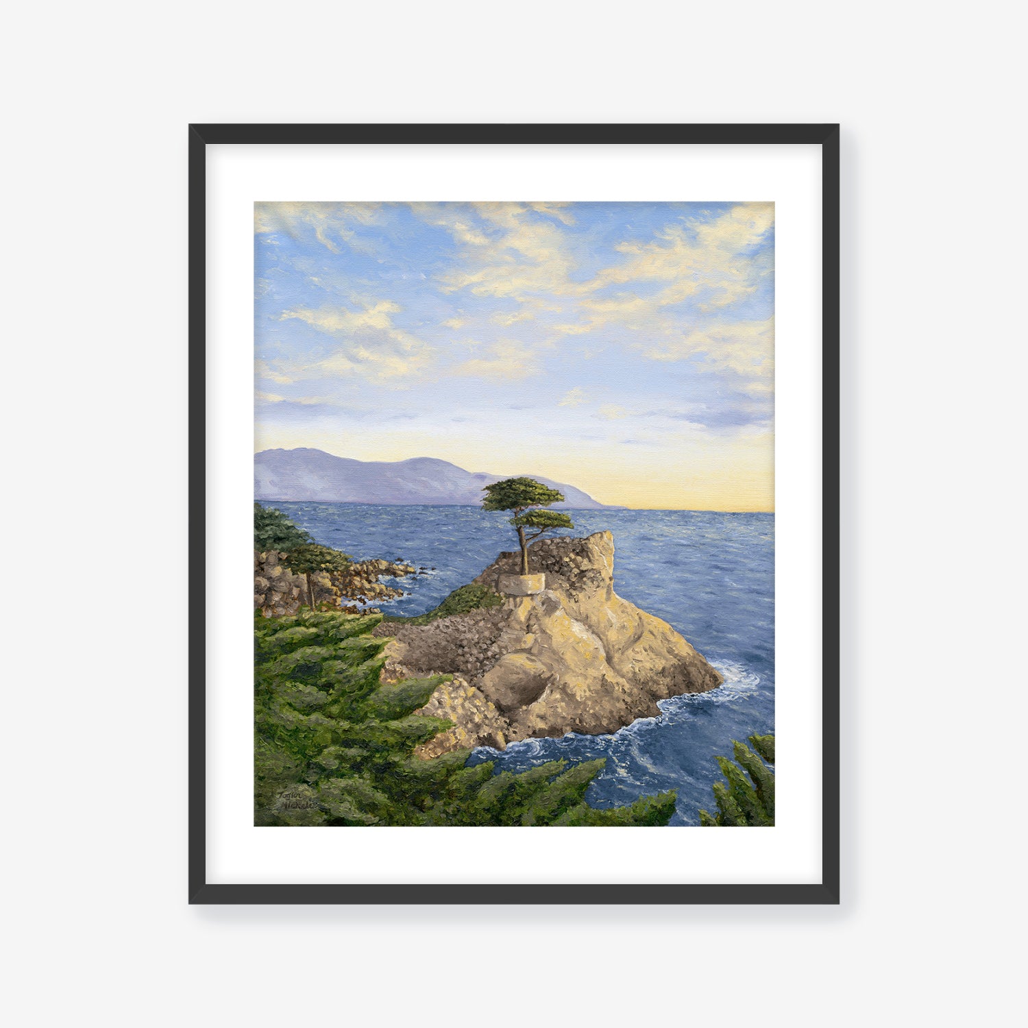 Framed artwork of a coastal scene with a tree on a rock, blue sky, and ocean. Black frame