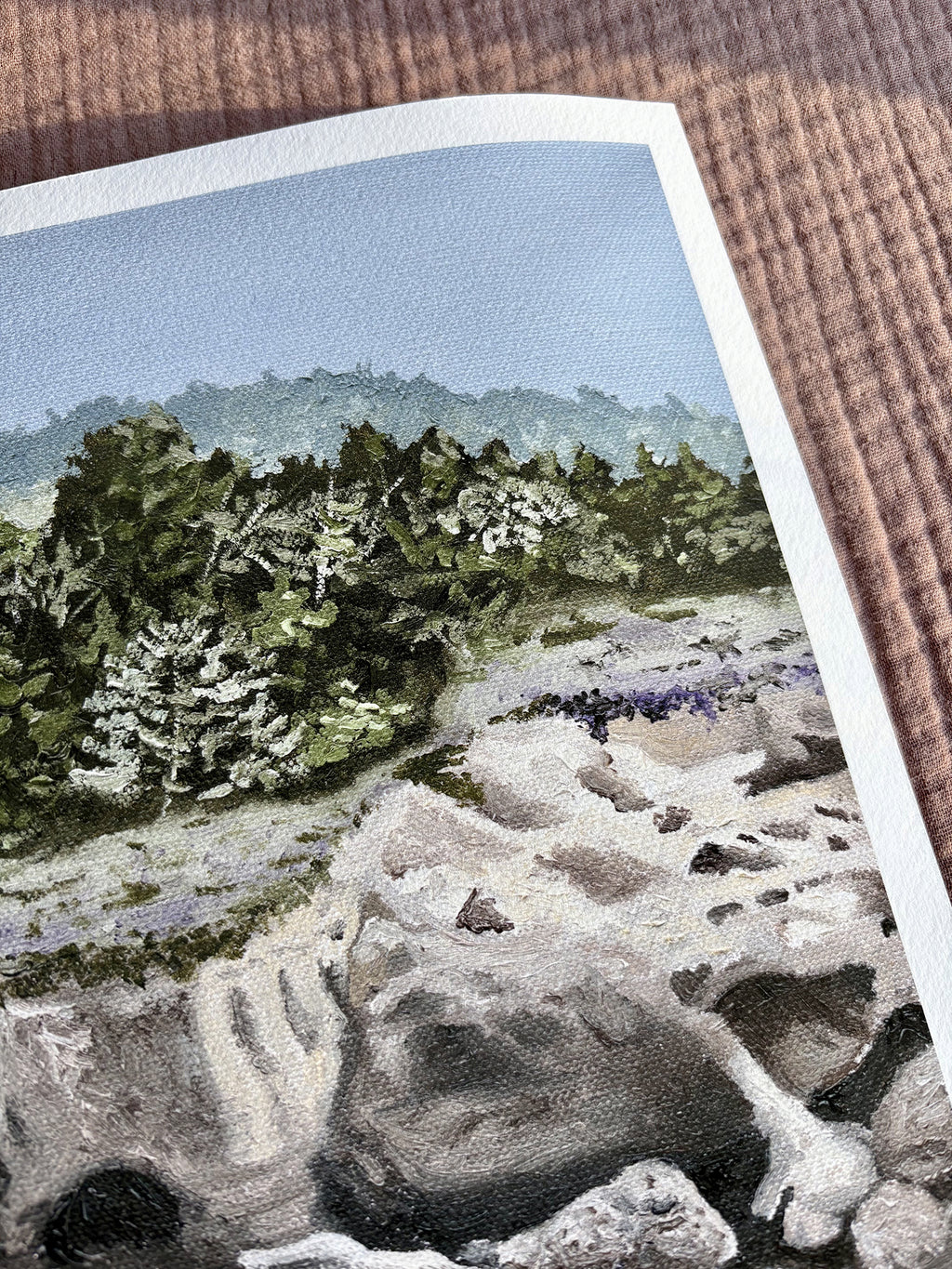 Close up detail of fine art print of Carmel Highlands painting of a landscape with trees and mountains on a textured surface