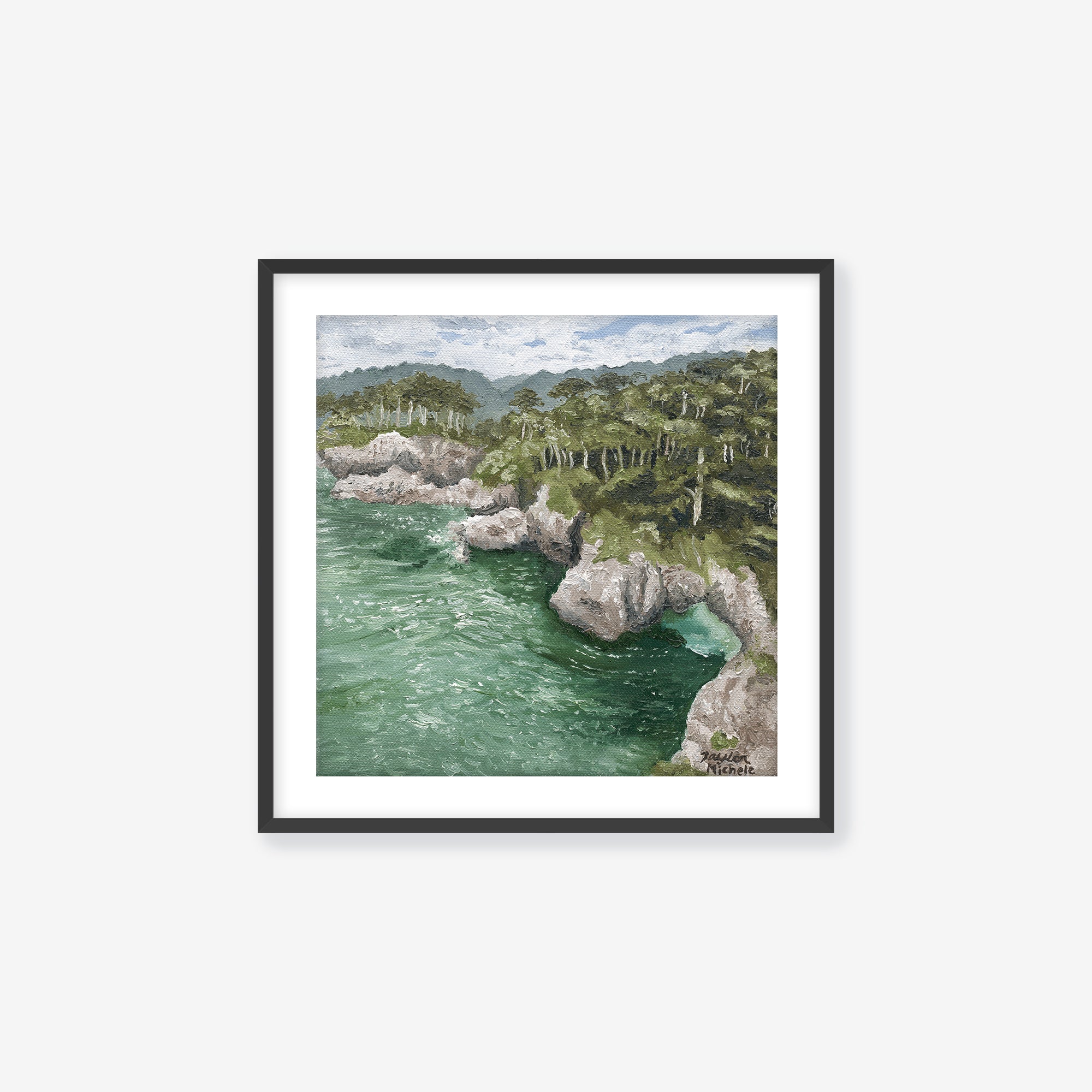 Scenic view of a coastal landscape with rocky cliffs and greenery. Black frame